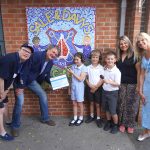 Millitec Managing Director Richard Ledger presenting a prize to three students from Sale & Davys C of E Primary School for winning the Media Starz radio competition.